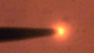 Nanoscale Corona Discharge in Liquids, Enabling Nanosecond Optical Emission Spectroscopy