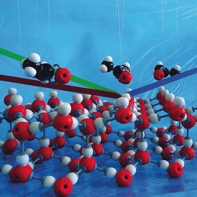 Comparative Adsorption of Acetone on Water and Ice Surfaces