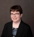 A headshot photo of Senior Editor Catherine Sheard
