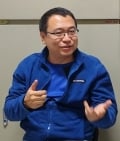 A headshot photo of Senior Editor Huijie Qiao
