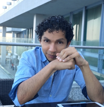 A headshot photo of Eric Ameca
